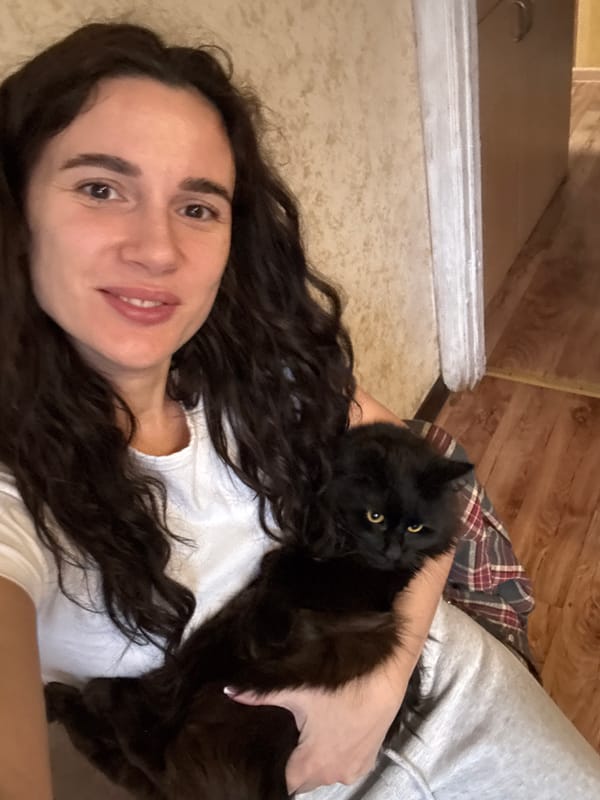 Woman's quiet afternoon with cat and salad documented in Chaikovsky