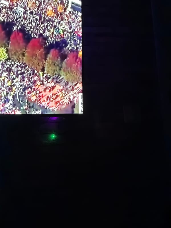 Television displays show crowds, maps in Velingrad, Bulgaria