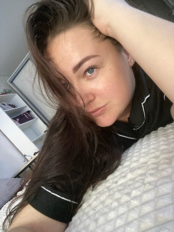 Parent applies heart-shaped cream to toddler's hands in Sochi