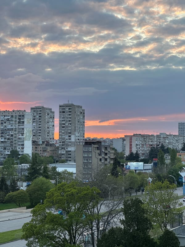 Urban sunset photography session captures dramatic sky, residential buildings