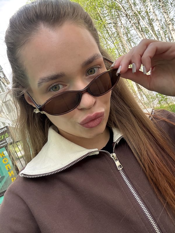 Woman documents spring flowers during morning walk in Chaikovsky