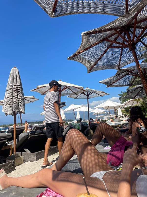 Laid-back beach day with lounge chairs, umbrellas, and ocean views.