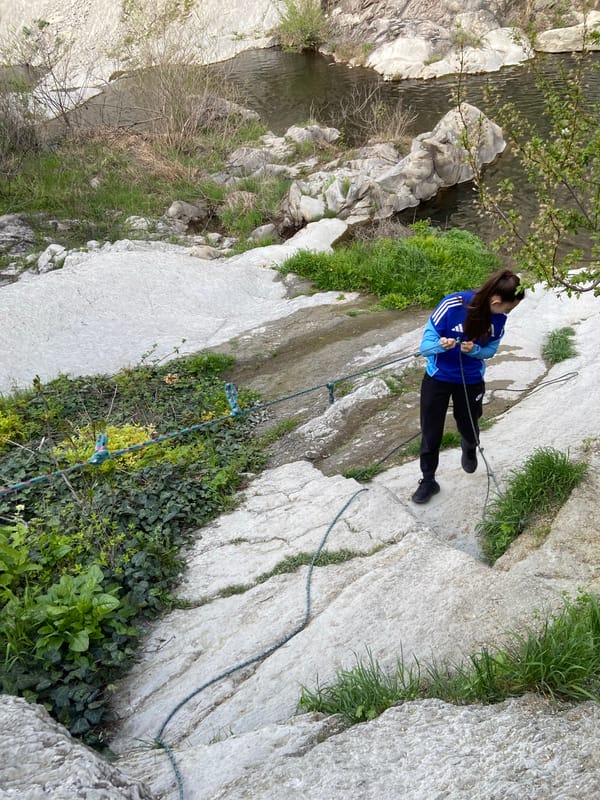 Rock climber scales cliffs near Kapinovo Waterfall, Bulgaria