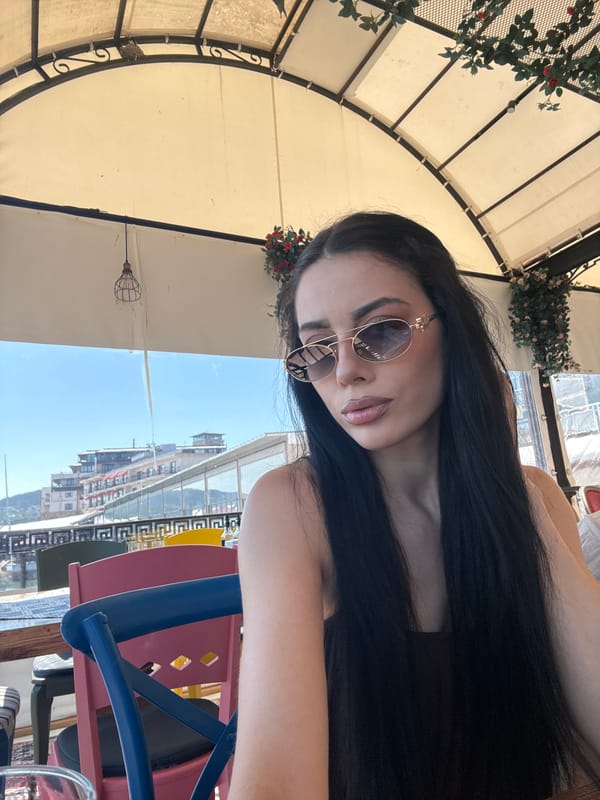 Tourist captures waterfront cafe and marina scenes during midday visit