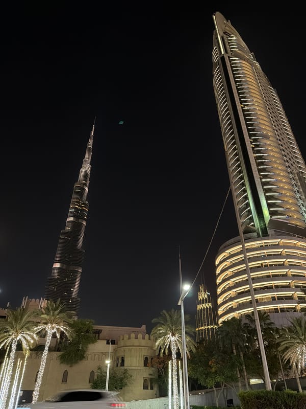 Downtown Dubai nighttime scenes documented showing illuminated landmarks, traffic