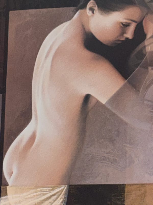 Woman photographed lying down with translucent covering