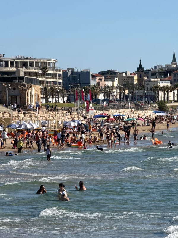 Busy summer beach day draws crowds to Tel Aviv waters