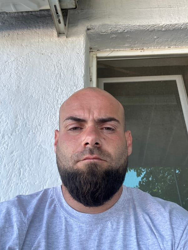 Man photographed multiple times in Bulgarian village street scene