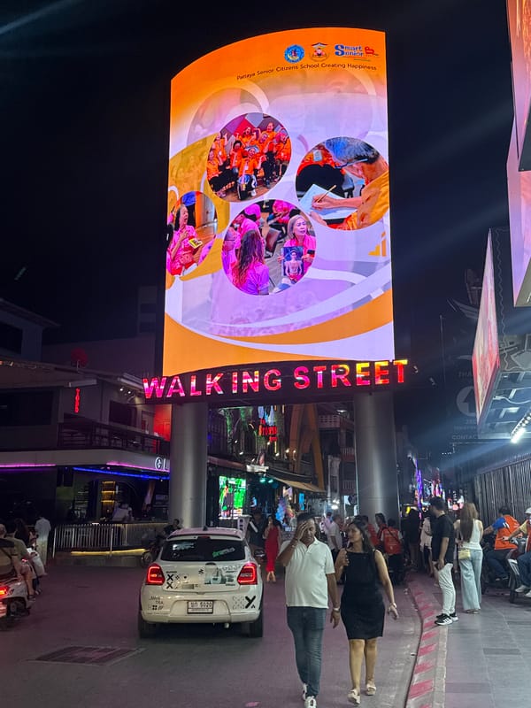 Evening crowds gather on Pattaya's illuminated Walking Street