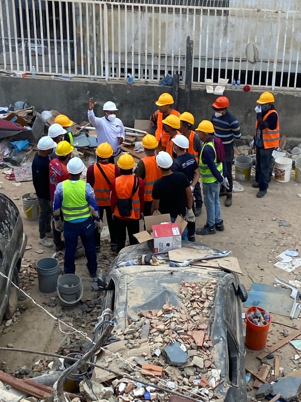 Demolition crew clears rubble at collapsed structure in Caracas