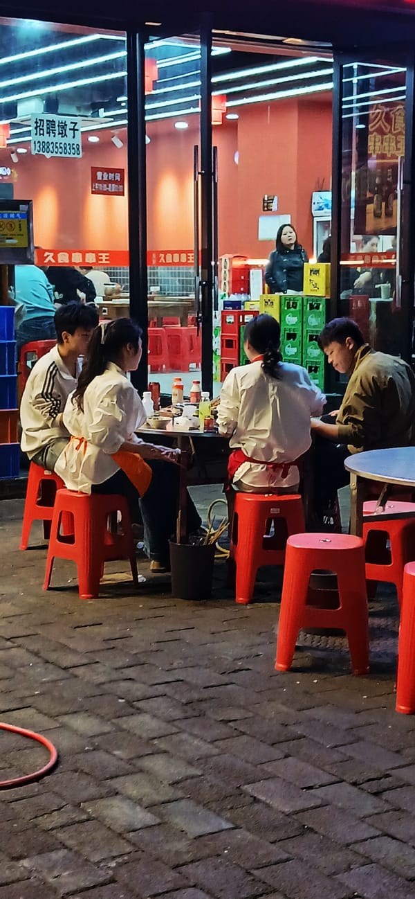 Evening street life unfolds in Jiulongpo District, China