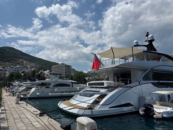 Yachts and an electric scooter at Budva marina