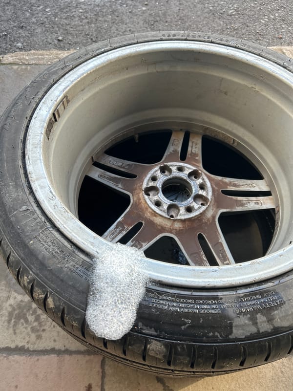 Abandoned rusted wheel found on concrete in Rutherglen