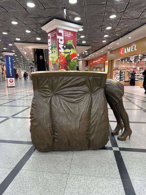 Visitor documents mall exhibits in Yekaterinburg including vintage vehicle