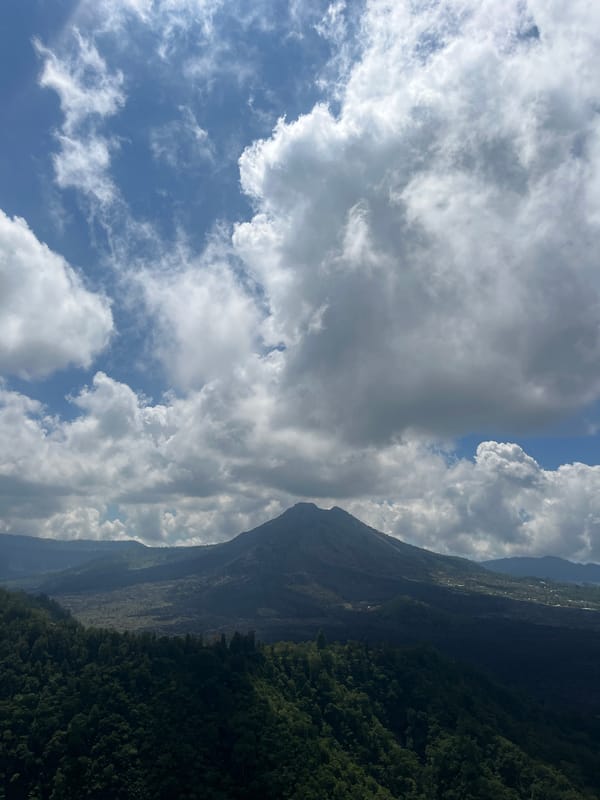 Tourist captures scenic mountain lake views in Kintamani, Indonesia