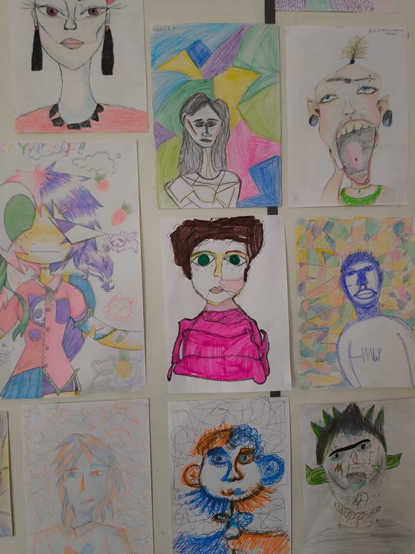 Amateur portrait collection displayed on wall in Riga