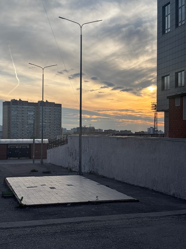 Evening scenes captured in Perm: parked BMW, sunset cityscape
