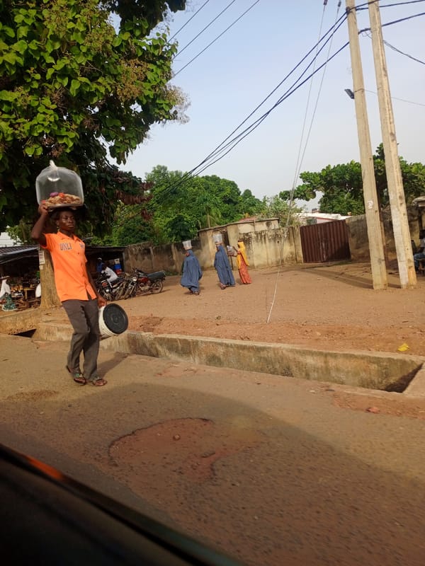 Pedestrians observed walking along street in Keffi, Nigeria