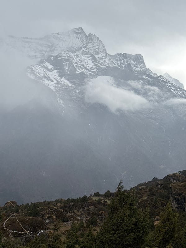 Heavy fog shrouds snow-capped mountains in Namche, Nepal