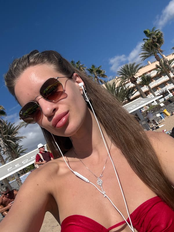 Sunny afternoon beach leisure captured in Los Cristianos, Spain