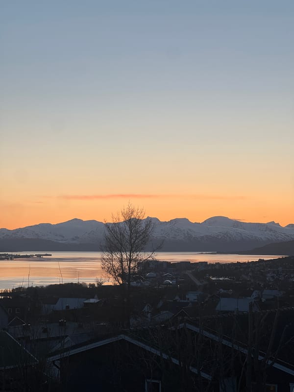 Arctic sunset documented over Tromsø cityscape and infrastructure