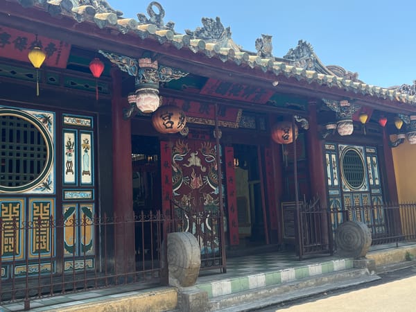 Tourist documents early morning walk through historic Hội An
