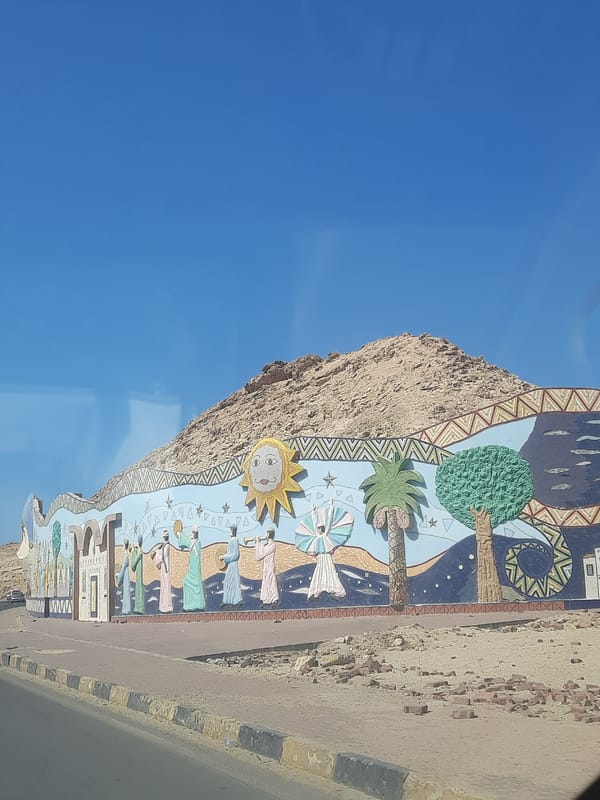 Colorful mural spotted on rocky outcrop in Al Hadaba