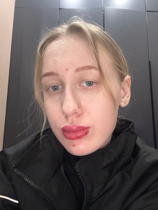 Woman takes multiple selfies indoors in Novoaleksandrovka