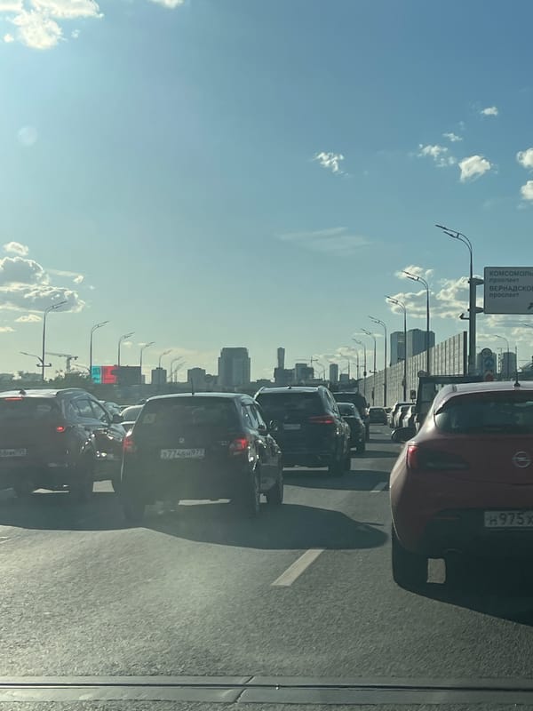 Gridlock on a Moscow highway under a clear summer sky