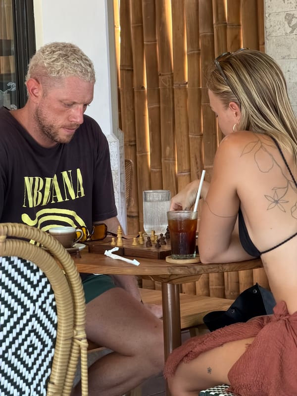 Couple plays early morning chess game in General Luna