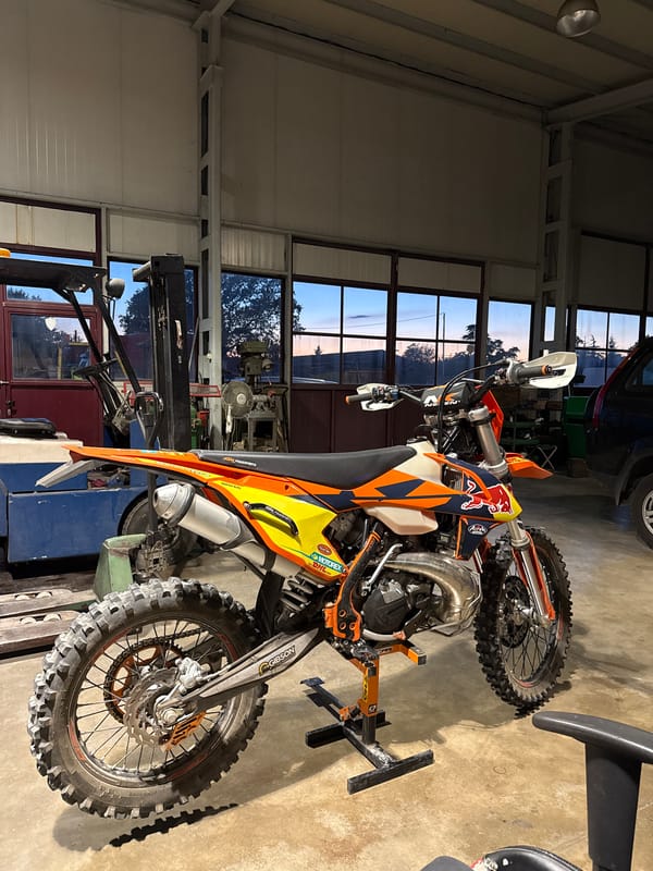 KTM and Red Bull dirt bikes in a Bulgarian garage