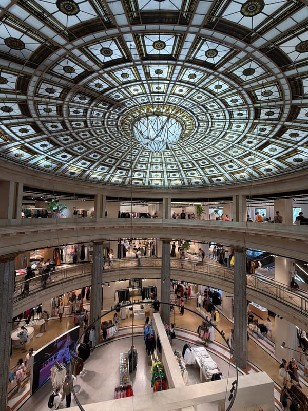 Inside a Barcelona department store with a stunning stained-glass dome