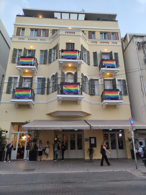Tel Aviv street life captured: rainbow flags, construction, electric scooter