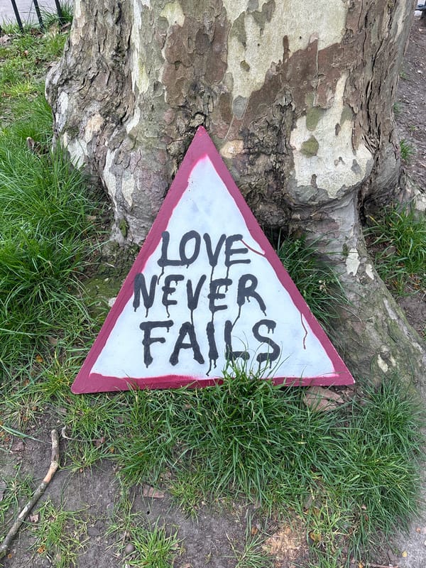 Hand-painted 'Love Never Fails' sign found on London ground