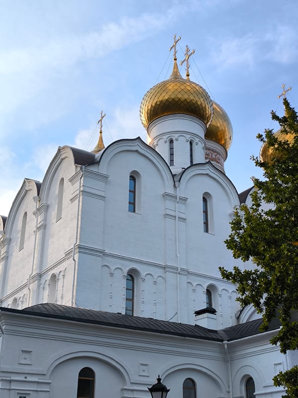Live violin outside a golden-domed Orthodox church