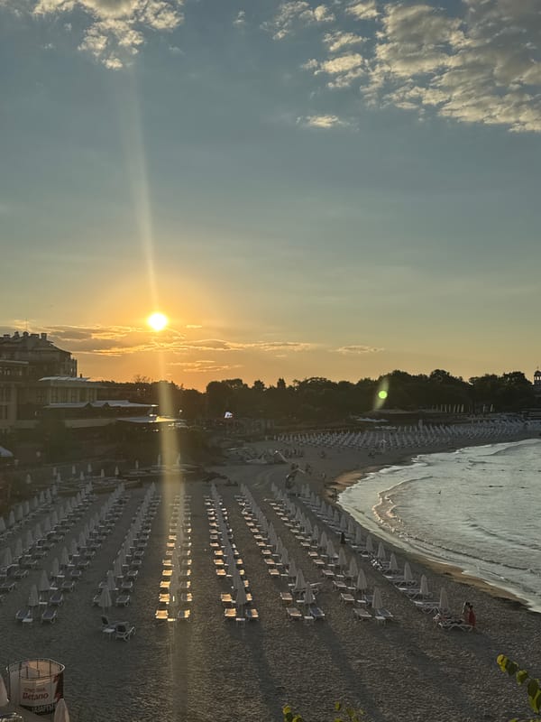 Sozopol beach at sunset, empty chairs and golden light