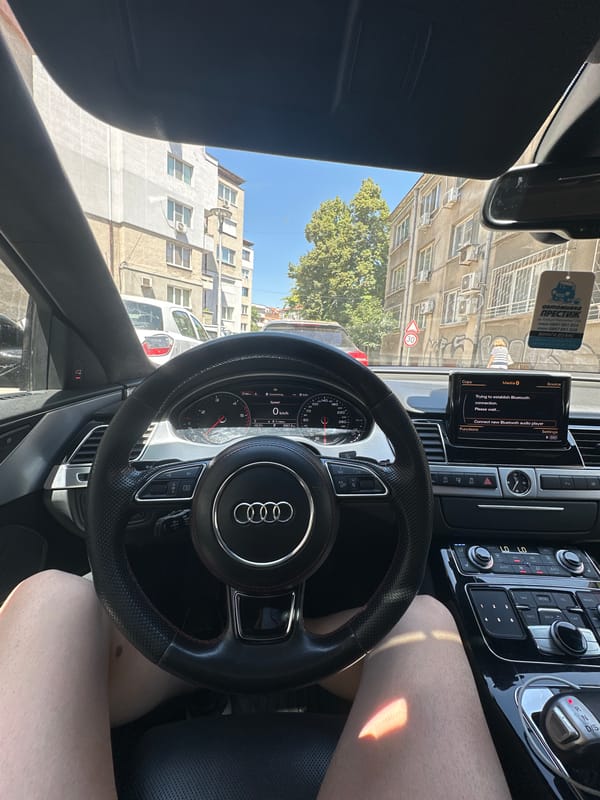 Black Audi parked on a Ruse street, inside and out