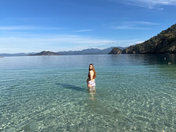 Man sets up beachside table service in Fethiye Turkey