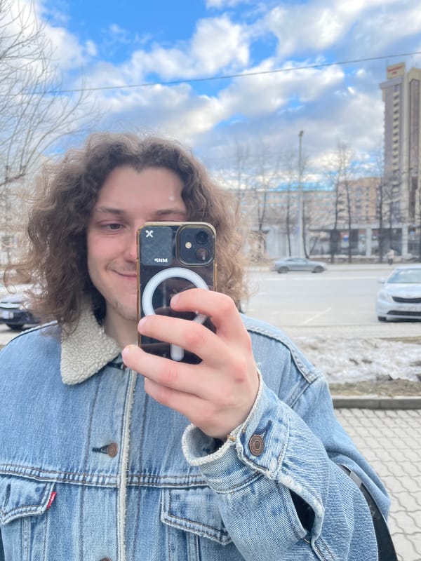 Person takes selfie near urban buildings in Yekaterinburg