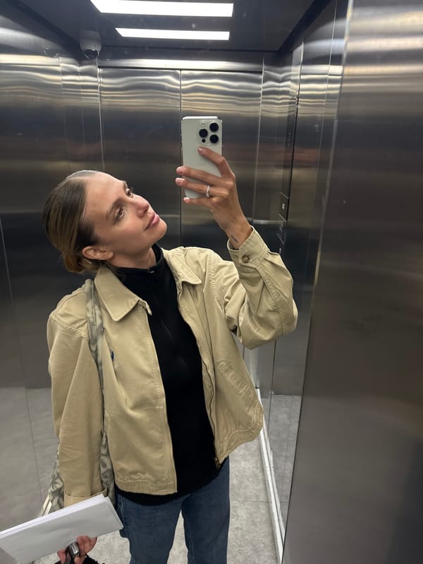 Woman Takes Selfie in Elevator