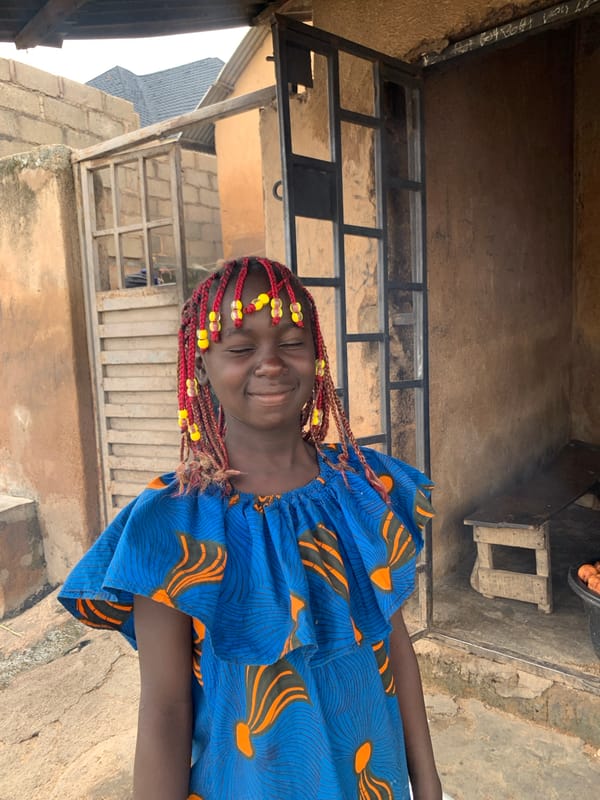 Colorful beads and patterned clothing in urban Jos