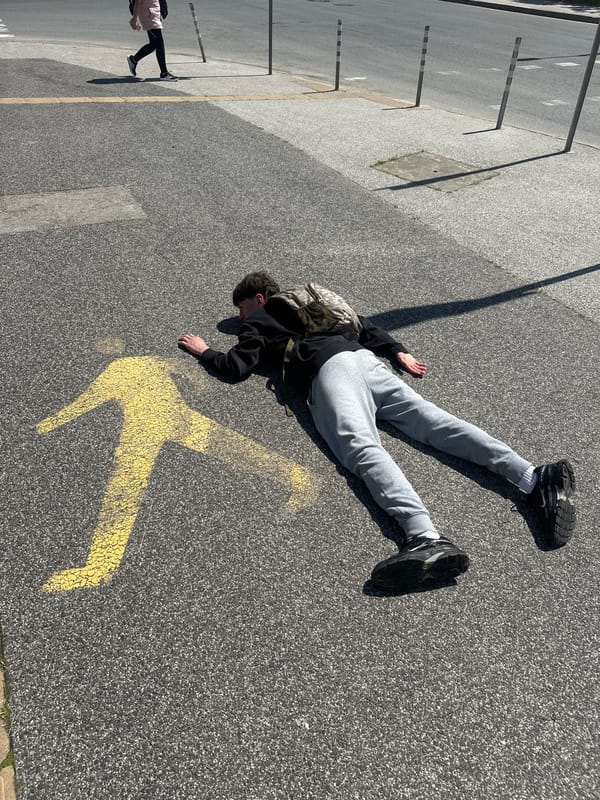 Person lying on street near Plovdiv stadium crossing