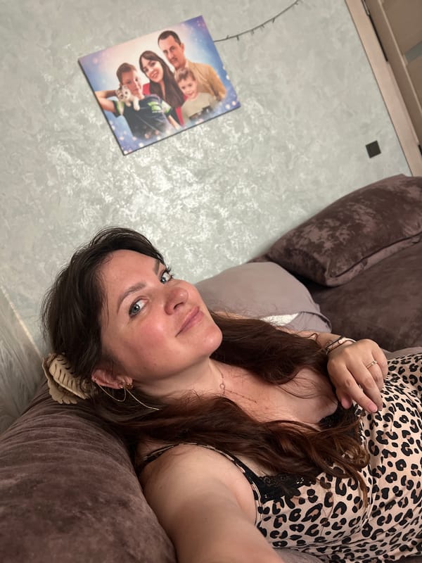 Casual afternoon at home on a brown sofa, Noviy