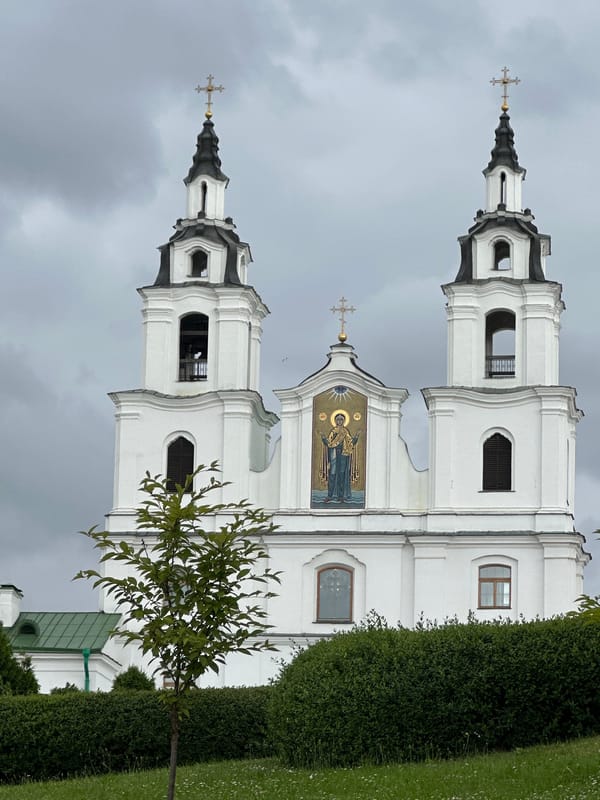 Minsk city center: churches, brick streets, and skyline on a cloudy afternoon