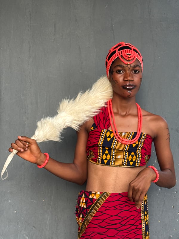 Woman in traditional Igbo attire photographed during cultural ceremony