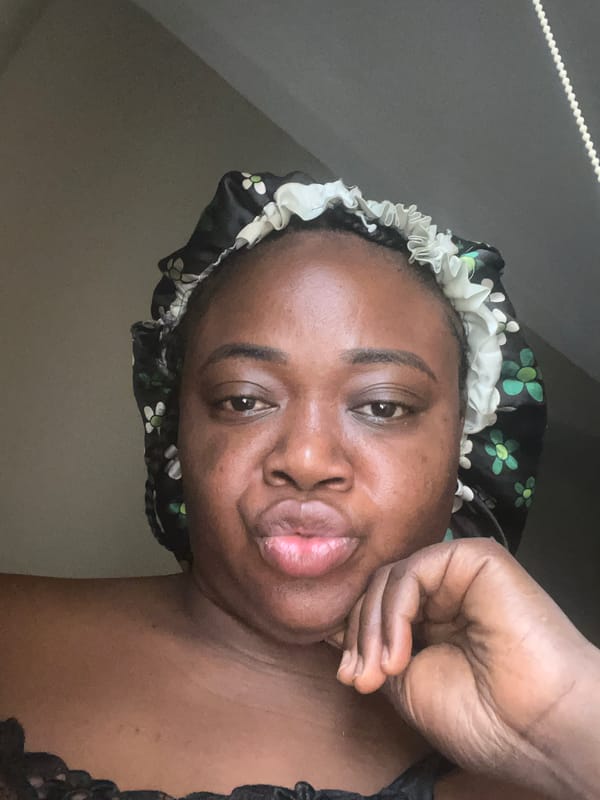 Morning portrait session captured in Abuja bedroom