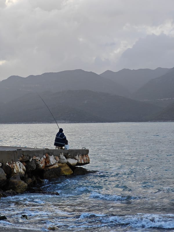 Fisherman spends afternoon on Demre pier under cloudy skies