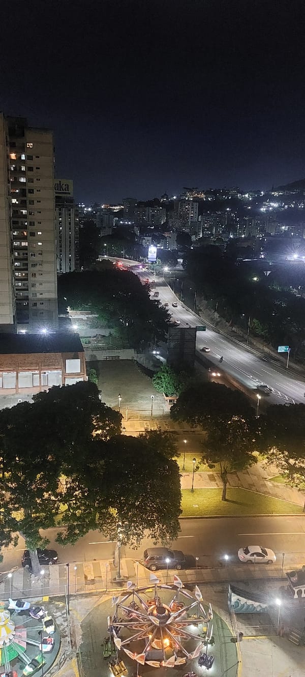 Nighttime cityscape captured overlooking illuminated Caracas Venezuela