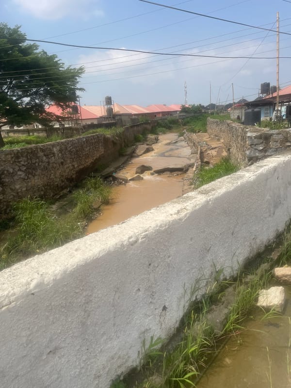 Street and market life across a busy Abuja neighborhood