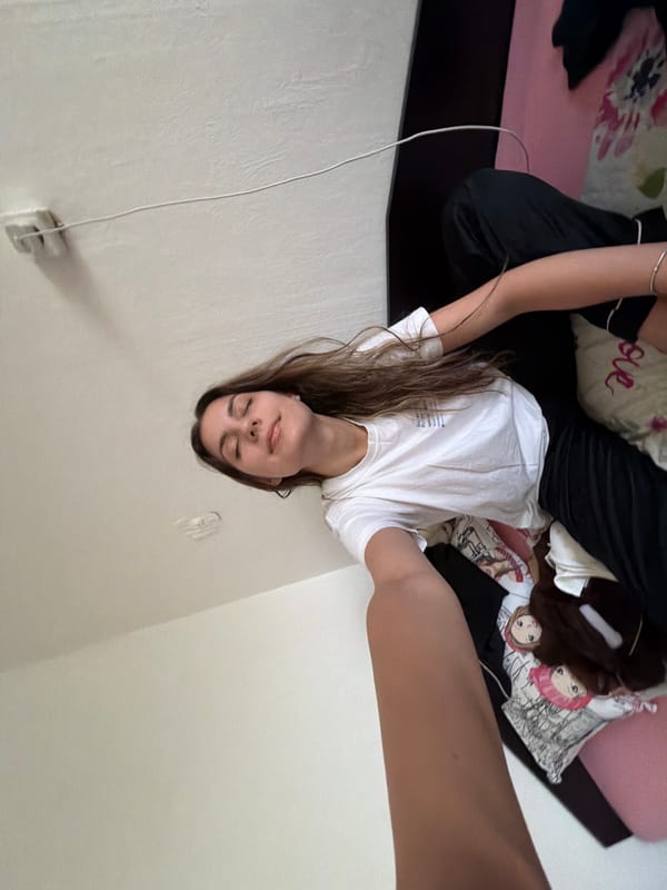Woman rests in Sofia bedroom during quiet afternoon